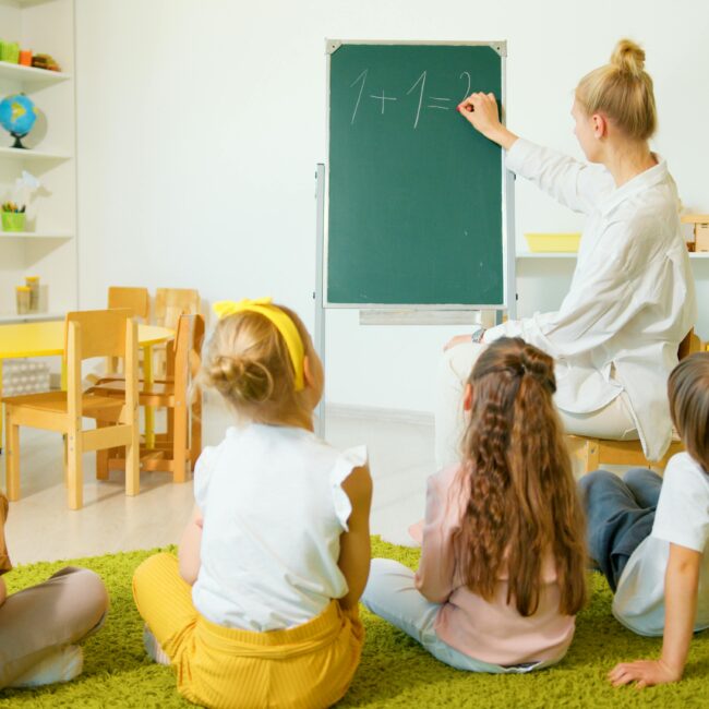Teacher Writing on the Blackboard